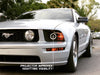 Raxiom 05-09 Ford Mustang Halogen 2010 Style LED Halo Headlights-Blk Hsng(Clear Lens/Excludes GT500) Raxiom